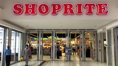 A man wearing a protective face mask walks outside a Shoprite store in Abuja, 3 Nigeria August 2020. Reuters/Afolabi Sotunde