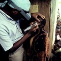 A health worker examines a child for signs of trachoma Joe McNally/Getty Images