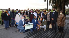 Members of the First Nations Collective gather around Jody Aufrichtig (LLPT), Chief !Garu Zenzile Khoisan (FNCT), Mayor Dan Plato and Queen Katrina Esau of the San