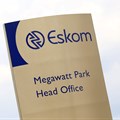 An Eskom logo is seen at the entrance of their head offices in Sunninghill, Sandton,file. Reuters/Siphiwe Sibeko