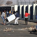 Demonstrators in Katlehong loot a shopping centre during protests following the imprisonment of former President Jacob Zuma. Source: Reuters/Siphiwe Sibeko