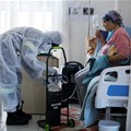 A healthcare worker assists a patient being treated at a makeshift hospital run by charity organisation The Gift of the Givers, during the coronavirus disease (Covid-19) outbreak in Johannesburg, South Africa, July 11, 2021. Reuters/ Sumaya Hisham