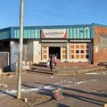 Widespread unrest and looting of shops in KwaZulu-Natal, like these at KwaMashu shopping centre, has badly impacted health services in the province from hospitals trying to function, with skeleton staff to the Covid-19 vaccination programme halting. Photo: Nokulunga Majola