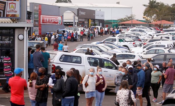 People queue to buy food at a supermarket with many stores staying closed as protests continue. Source: Reuters/Rogan Ward