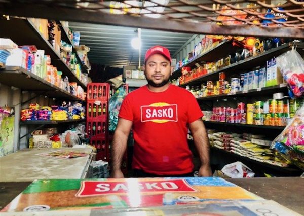 Sharif Ahmed has the only shop left in Langaville extension 4 thanks to a brave widow and a group of local residents. Photo: Kimberly Mutandiro