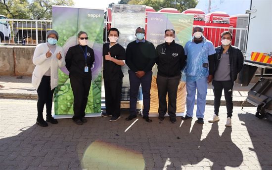 Helen Joseph team received the pharmaceutical fridge from Sappi's Sipho Ngubane (centre)