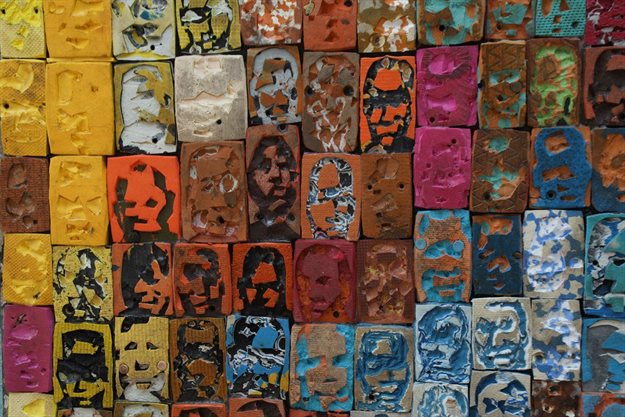 An artwork of the Ivorian painter Aristide Kouame, 26, who paints optical effects with worn soles is pictured at his workshop in Abidjan, Ivory Coast. Reuters/Luc Gnago