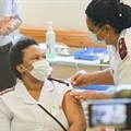 Sister Zoliswa Gidi-Dyosi, a registered nurse and midwife, receives her Covid-19 vaccine at the Khayelitsha Hospital, Cape Town, in February 2021. Archive photo: Jeffrey Abrahams