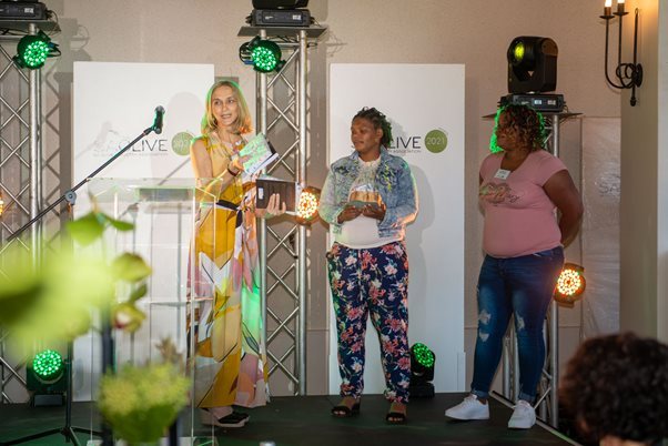 Source: Supplied - Carmelita Brink (right) and Lee Ann Swarts (middle) receive the Worker of the Year Award from SA Olive Manager Vittoria Jooste.
