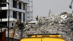 Nigeria races to find survivors as 22 die in building collapse