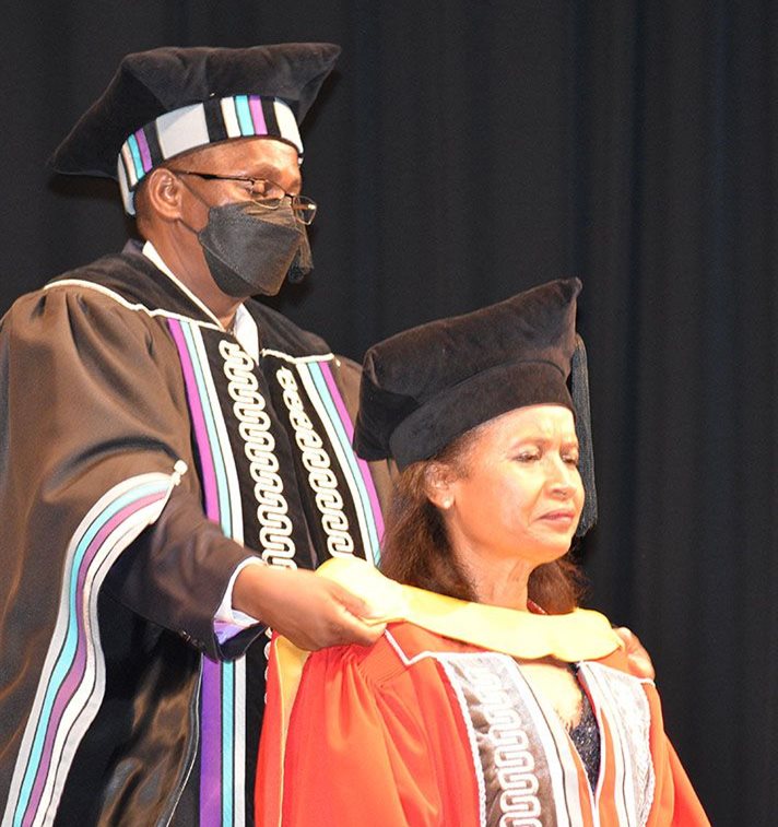 Dr Geraldine Fraser-Moleketi receives an honorary doctorate from the North-West University. She was nominated for an honorary doctorate by the NWU’s Faculty of Humanities. Prof Michael Temane, deputy registrar, hoods her.