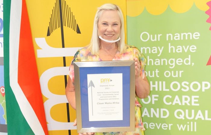 Professor Elain Vlok, Clover manager for Clover Mama Afrika Trust, accepting the PMR Award. | Source: Supplied.