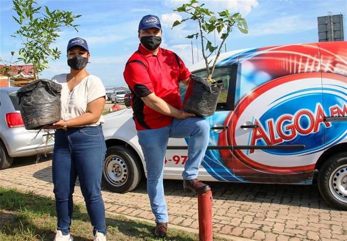 Algoa FM presenters Roch-Lè Bloem (left) and Kaycee Rossouw at a school for tree planting.