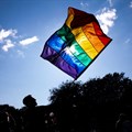 Image: A participant holds a rainbow flag during the WorldPride in Copenhagen, Denmark 21 August 2021. Olafur Steinar Gestsson/Ritzau Scanpix/via Reuters
