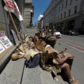 Members of the Khoi, an indigenous group, picket outside the high court during a hearing, opposing housing development for the new Africa headquarters of U.S. retail giant Amazon, in Cape Town. Reuters/Shafiek Tassiem