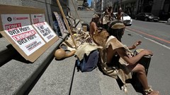 Members of the Khoi, an indigenous group, picket outside the high court during a hearing, opposing housing development for the new Africa headquarters of U.S. retail giant Amazon, in Cape Town. Reuters/Shafiek Tassiem