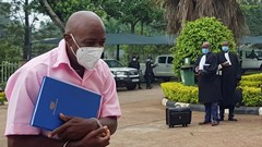 Paul Rusesabagina, portrayed as a hero in a Hollywood movie about Rwanda's 1994 genocide, walks in handcuffs to a courtroom in Kigali, Rwanda 17 February 2021. Reuters/Clement Uwiringiyimana/File Photo