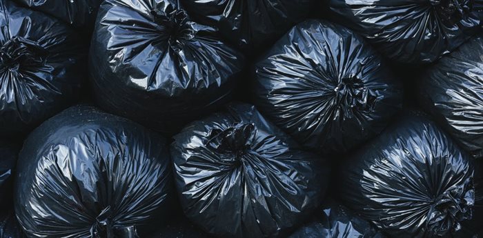 When people have to pay for every bag of trash they throw out, they produce less waste. | Source: Mint Images RF via Getty Images.