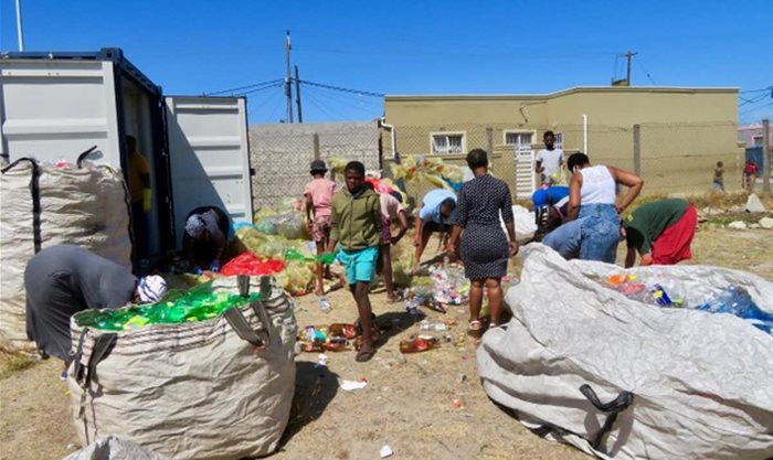 Volunteers from Eluvukweni Anglican Church in Crossroads in Cape Town, sorting plastic bottles collected by the congregation. | Source: Teresa Sandra Perez