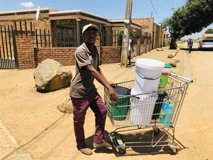 Sibusiso Khumalo, who is unemployed and lives in Toyi Toyi informal settlement in Tsakane, has been fetching water for families, for a fee. Source: Kimberly Mutandiro