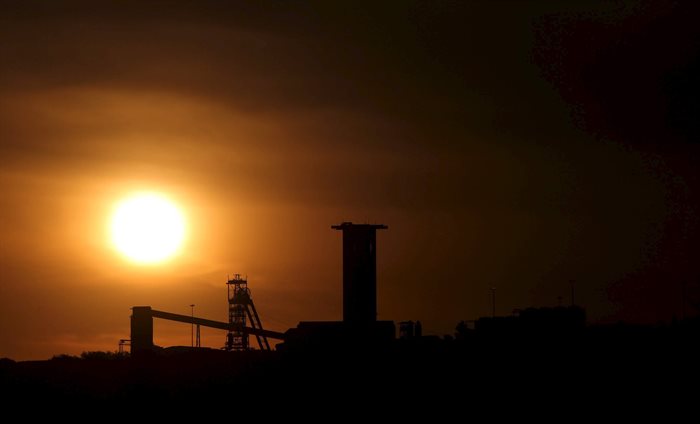 Sun sets behind a shaft outside the mining town of Carletonville, west of Johannesburg. Source: Reuters/Siphiwe Sibeko