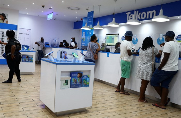 Customers are served at a branch of Telkom, in Johannesburg on 2 March 2022. Reuters/Siphiwe Sibeko/File Photo