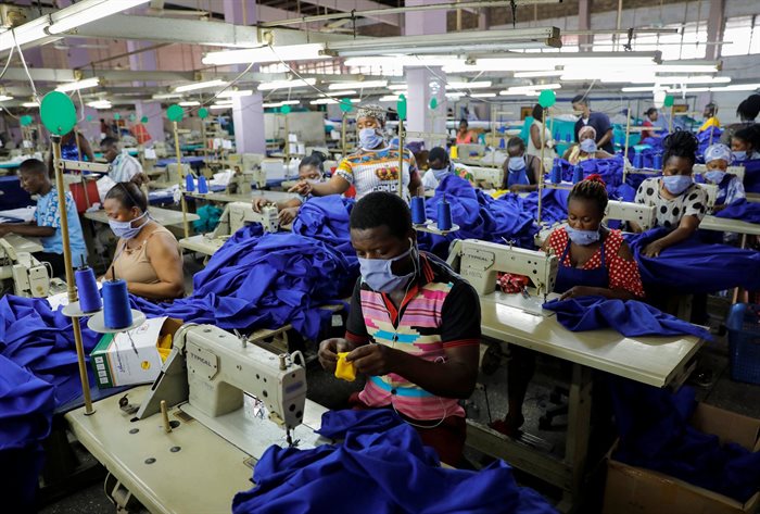 Workers of a local factory begin the production of personal protective gear for local frontline health workers as commissioned by the government, during the partial lockdown in Accra to slow the spread of the coronavirus disease (Covid-19), in Accra, Ghana, 10 April 2020. Reuters/Francis Kokoroko