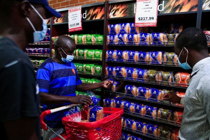Maxwell Hwayo, 52, shops at a grocery store in Harare, Zimbabwe, March 17, 2022. REUTERS/Philimon Bulawayo