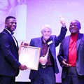Supplied. Anthony Heard (centre), gives the thumbs up on receiving his Lifetime Achiever Award from (left) Sanef chairperson, Sbu Ngalwa and (right) Standard Bank CEO, Lungisa Fuzile