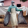 Source: Reuters. A health worker in protective clothing carries waste for disposal outside the isolation ward where victims of the deadly Marburg virus are treated in the northern Angolan town of Uige, File.