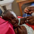 Source: Reuters. A nurse administers the malaria vaccine to an infant at the Lumumba sub-county hospital in Kisumu, Kenya.