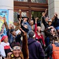 Members of the Goringhaicona and others opposing the River Club development celebrate the dismissal of an urgent application to depose Tauriq Jenkins (centre) as supreme high commissioner of the Goringhaicona Khoi Khoin Indigenous Traditional Council. Together with the Observatory Civic Association, the council has led litigation against the development. Photo: Steve Kretzmann / GroundUp