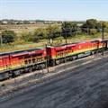 A Transnet Freight Rail train is seen next to tons of coal mined from the nearby Khanye Colliery mine, at the Bronkhorstspruit station, in Bronkhorstspruit, around 90 kilometres north-east of Johannesburg, South Africa, April 26, 2022. REUTERS/Siphiwe Sibeko/File Photo