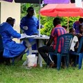 Source: Reuters. Ugandan health workers speak to members of the community before carrying out the first vaccination exercise against the ebola virus in Kirembo village.