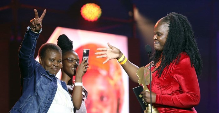 Amanda Maliba in red celebrates with her mother Lindile Malina and sister Khathutshelo Maliba. Source: Supplied.