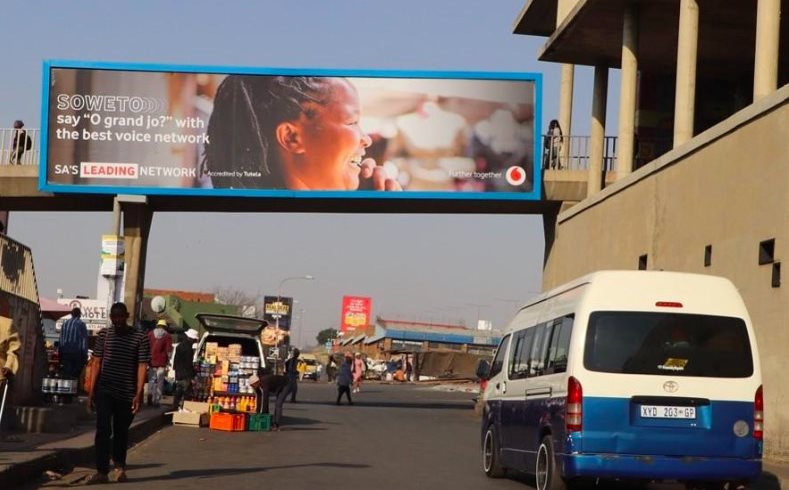 A Vodacom Soweto Takeover billboard on a bridge leading into the Baragwanath Taxi Rank