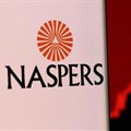 Image: Naspers' logo is pictured on a smartphone in front of stock graph displayed in this illustration taken, 4 December 2021. Reuters/Dado Ruvic/Illustration