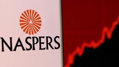Image: Naspers' logo is pictured on a smartphone in front of stock graph displayed in this illustration taken, 4 December 2021. Reuters/Dado Ruvic/Illustration