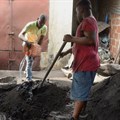 Roland Adjovi, a producer of Ecolo coal, transforms plant waste into bio charcoal at his workshop in Cotonou, Benin, 27 January 2023. Reuters/Charles Placide Tossou