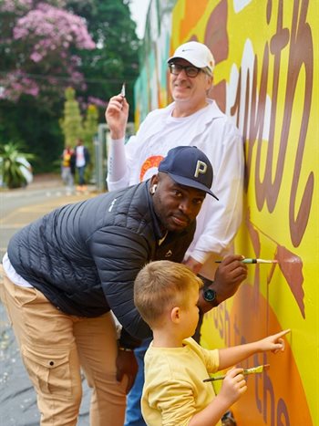 East Coast Radio Breakfast show presenters at Hillcrest Primary School for the first ever mural for new campaign, 'Here with You'