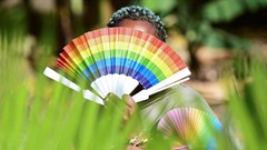 File photo: Quin Karala, 29, a member of the lesbian, gay, bisexual, transgender, intersex and queer (LGBTQ) community and a single mother of one poses for a picture with rainbow colours at the offices of Rella Women's Empowerment Program, for LGBTQ rights advocacy, after a Reuters interview in Kulambiro suburb of Kampala, Uganda 4 April 2023. Reuters/Abubaker Lubowa/File Photo