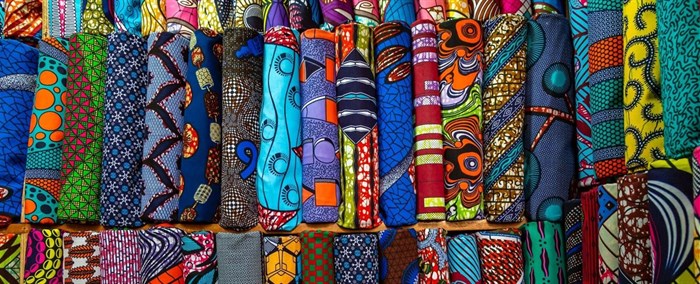 Colourful wax prints in Abidjan, Ivory Coast (Photo credit: Eva Blue on Unsplash)