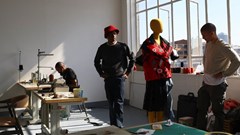 File photo: South African aspiring designers Khumo Morojele and Klein Muis look at one of their designs made from second hand clothing imported from the West and sold in bales in markets known as Dunusa, in Johannesburg South Africa, 3 July 2023.Reuters/Siphiwe Sibeko/File Photo