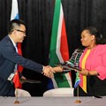Huawei South Africa CEO Will Meng and Acting DG Ms Nonkqubela Jordan-Dyani of the DCDT signing the partnership agreement. Source: Supplied