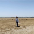 Tunisian environmental activist, Radhia Haddad, stands on the dried-out Ariana lagoon, in Ariana, Tunisia 11 August 2023. Reuters/Jihed Abidellaoui