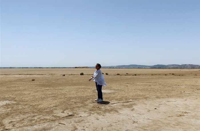 Tunisian environmental activist, Radhia Haddad, stands on the dried-out Ariana lagoon, in Ariana, Tunisia 11 August 2023. Reuters/Jihed Abidellaoui