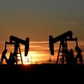 Pump jacks operate at sunset in an oil field in Midland, Texas. Source: Reuters/Nick Oxford