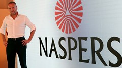 Bob van Dijk, CEO of e-commerce group Naspers, poses for a photograph in front of the company logo after holding a media briefing in Johannesburg. Source: Reuters/Siphiwe Sibeko
