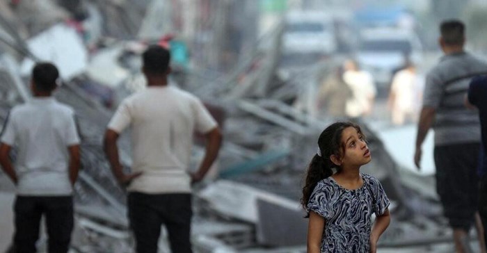 Source: Unicef/Mohammad Ajjour. Amal, 7 years old, contemplates her neighbourhood in the wake of the houses being levelled to the ground.