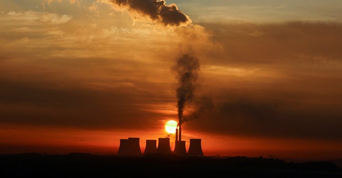 Sun rises behind the cooling towers of Kendal Power Station as the Eskom's ageing coal-fired plants cause frequent power outages, near Witbank. Source: Reuters/Siphiwe Sibeko